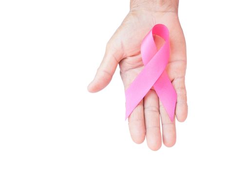 Closeup Old woman hand holding pink ribbon on white background ,Awareness breast cancer concept