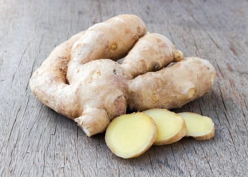 Fresh ginger on old wood background,raw material for cooking