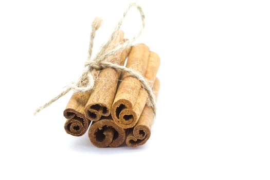 Whole bunch of cinnamon on a white background.