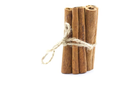 Whole bunch of cinnamon on a white background.