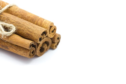 Whole bunch of cinnamon on a white background.
