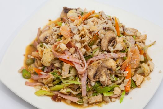 Sauteed vegetables with chicken, pork, jam and shrimps preparation: Ready served wok-Sauteed vegetables and meats