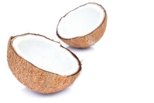 Closeup half of brown coconut shell on white background
