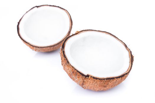 Closeup half of brown coconut shell on white background