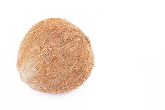 Closeup brown coconut shell on a white background, raw material for milk and coconut oil