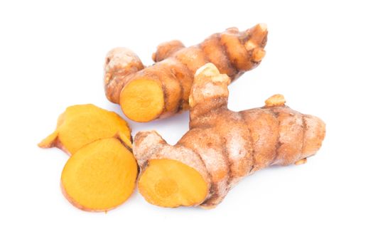 Closeup turmeric roots slices on white background