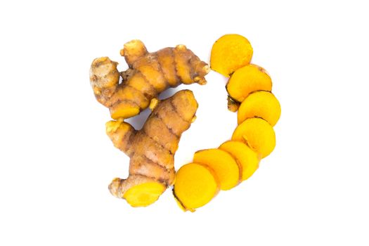 Closeup turmeric roots slices on white background