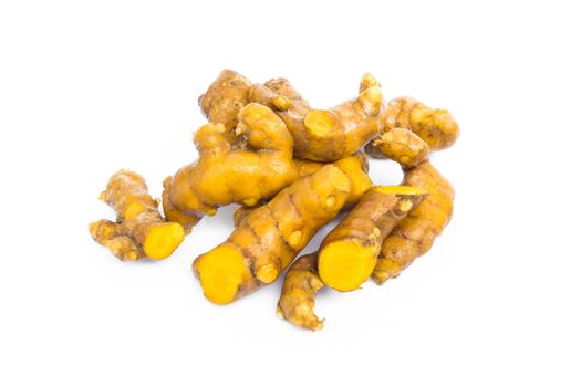 Closeup turmeric roots slices on white background