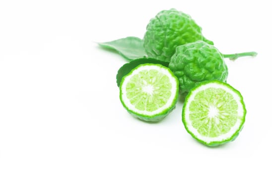 Closeup bergamot slice on white background, selective focus