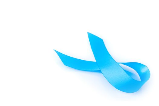 Blue ribbon on white background prostate cancer awareness concept