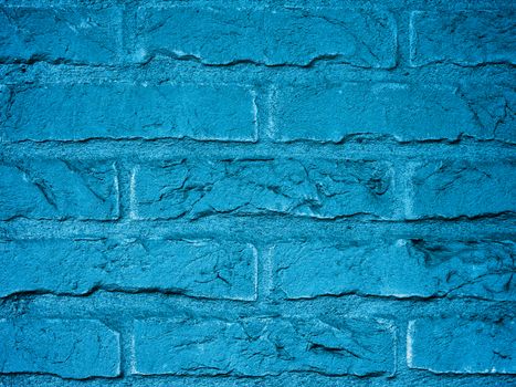 Background of Blue Brick Wall with Cracked Surface and Cobweb in Corners closeup Outdoors