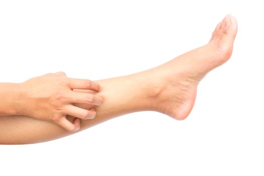 Woman hand scratching on feet with white backgroud for healthy concept