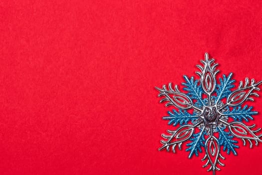 Christmas background with Christmas toys as background. snowflakes on a red background