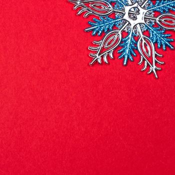 Christmas background with Christmas toys as background. snowflakes on a red background