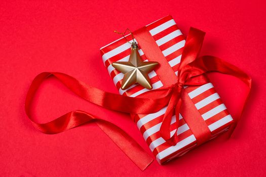 Christmas gift, toy, Snowflakes in the foreground. red background