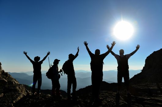 mountaineering group and summit happiness