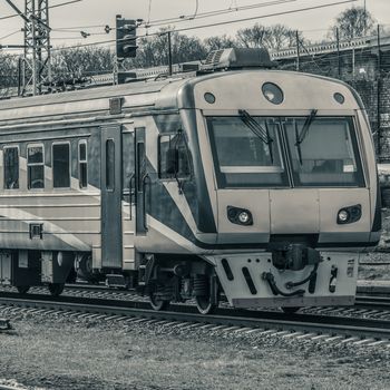 Modern passenger electric train moving at the old terminal