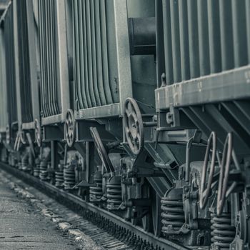 Green cargo wagons. Freight train in action