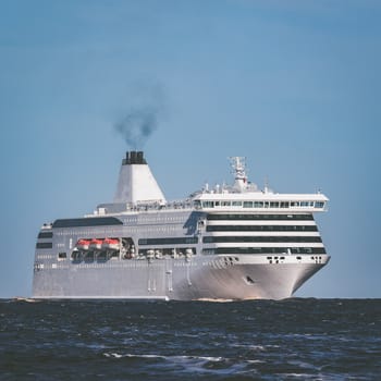 White cruise liner sailing on a clear day