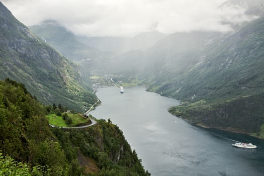 Geiranger in a cloudy and foggy day seen from above, Norway