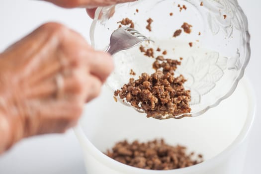 Step by step Levantine cuisine kibbeh preparation : Mixing the ingredients to prepare kibbeh filling into a bowl