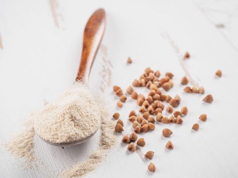 Buckwheat flour and buckwheat on white background Copy space.