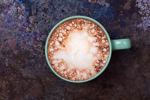 Hot chocolate with marshmallows on grunge dark table