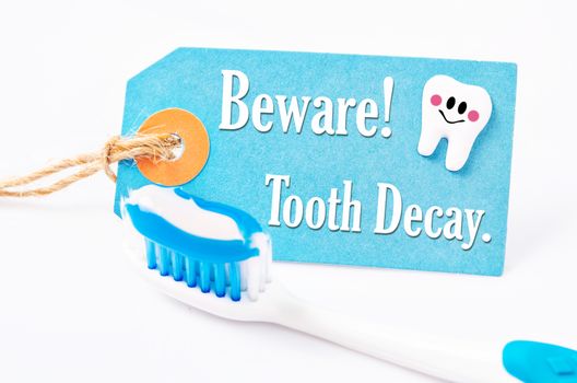 Beware tooth decay with toothpaste and toothbrush.