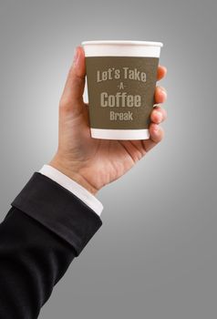 Hand of Businessman holding paper coffee cup with Let's take a coffee break text.