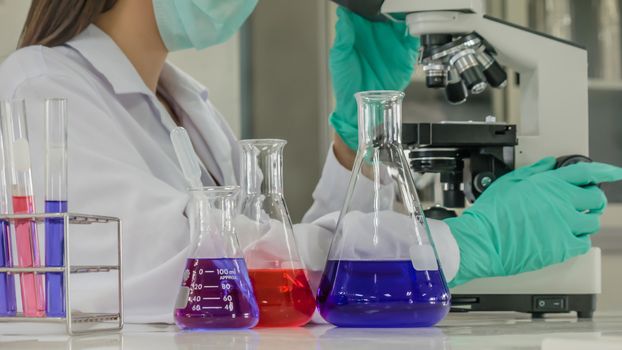 scientist with equipment and science experiments in laboratory