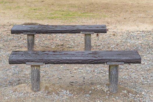 wet empty bench in the park