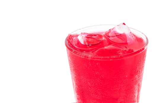Closeup red soft drink with strawberry flavor in glass on white background