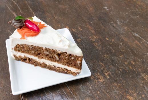 Carrot cheesecake , carrot cake on wood table background