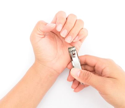 Closeup women cut fingernails on white background