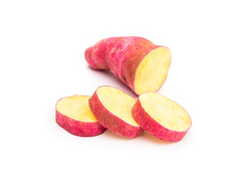 Sweet potato and slice on white background