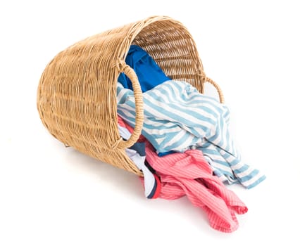 Clothes on wicker baskets for washing preparations whit white background, workhouse concept