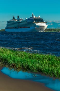 Big white cruise ship sailing to the Baltic sea at clear day