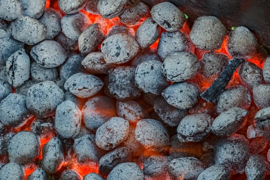 Hot flamed barbecue coal in a grill at summer party