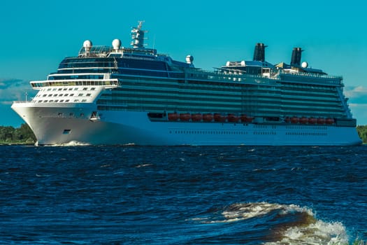 Big white cruise ship sailing to the Baltic sea at clear day