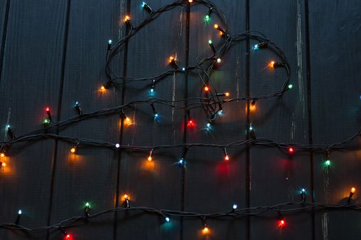 Colourful of decorative light on black wood