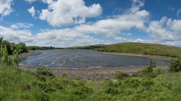 Landscape of Killington lake reservoir located in near Kendal South Lakeland District of Cumbria UK