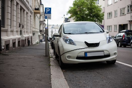 Electric car charging station in Oslo. Eco automobile that sparked a revolution