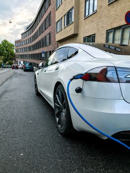 Electric car charging station in Oslo. Eco automobile that sparked a revolution