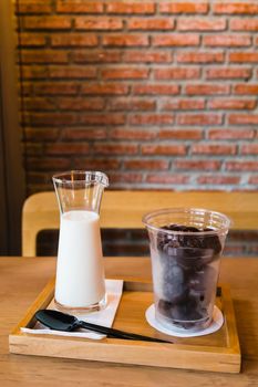 Frozen chocolate with fresh milk on wooden table