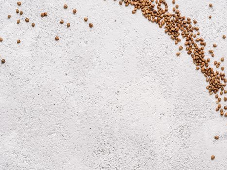 Flax seeds with copy space. Brown flax seed on gray concrete textured background. Top view or flat lay. Copy space. Healthy food and diet concept