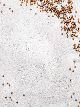 Flax seeds with copy space. Brown flax seed on gray concrete textured background. Top view or flat lay. Copy space. Healthy food and diet concept