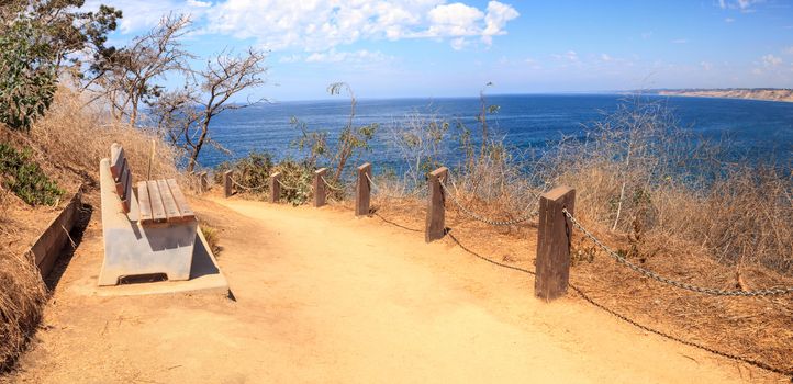 Hiking trails and benches above the coastal area of La Jolla Cove in Southern California in summer on a sunny day