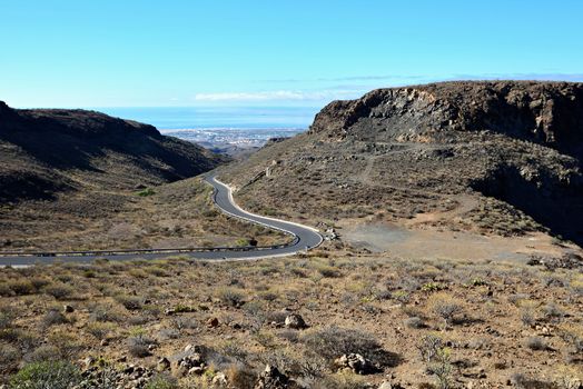 View of  Gran Canaria mountains valley with curvy road.