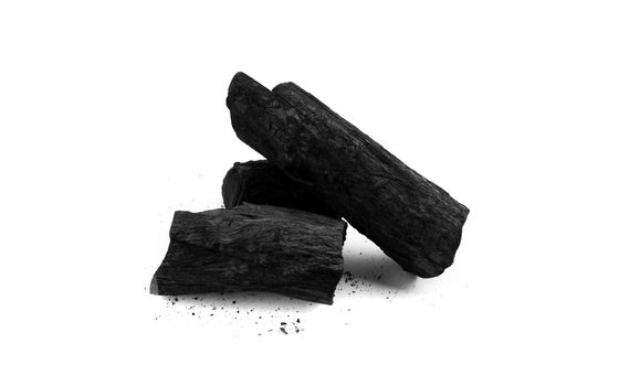 Black charcoal and debris on white background