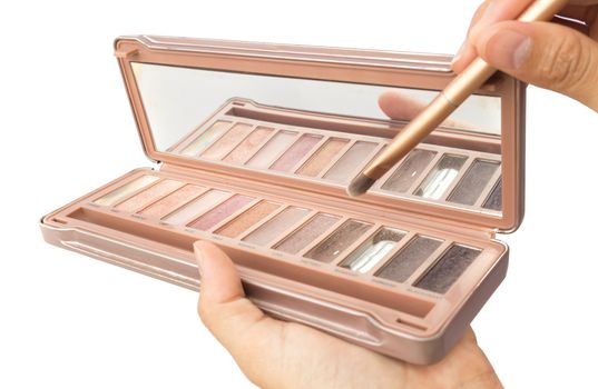 Women hand hold makeup brush and makeup cheeks for beauty concept